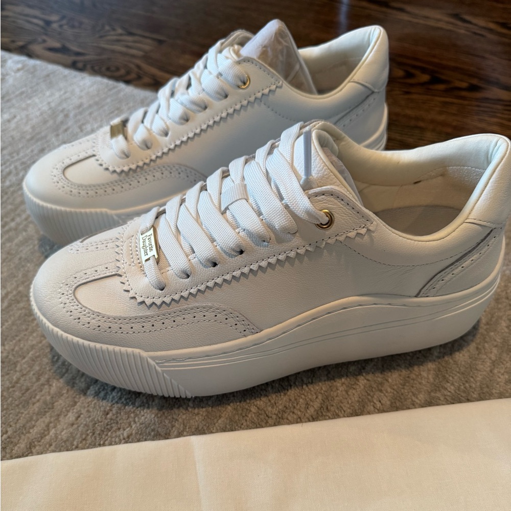 Brand new. Never worn. Too big for me & missed the return window.